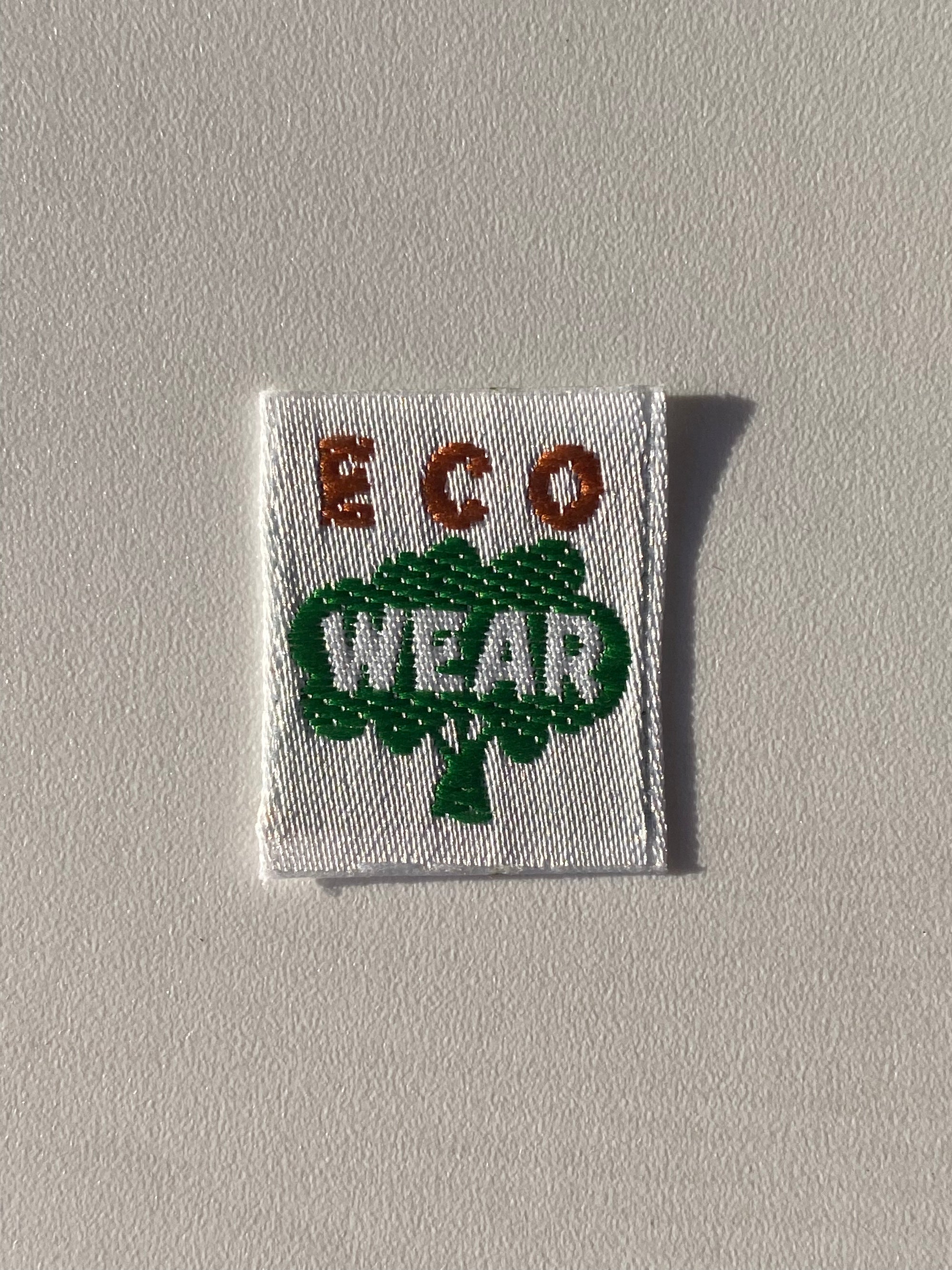 Etiqueta termoadhesiva tejida ECO WEAR