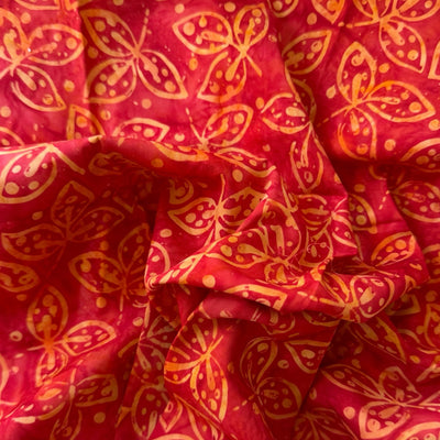 Tela batik follaje tropical amarillo naranja y verde oliva