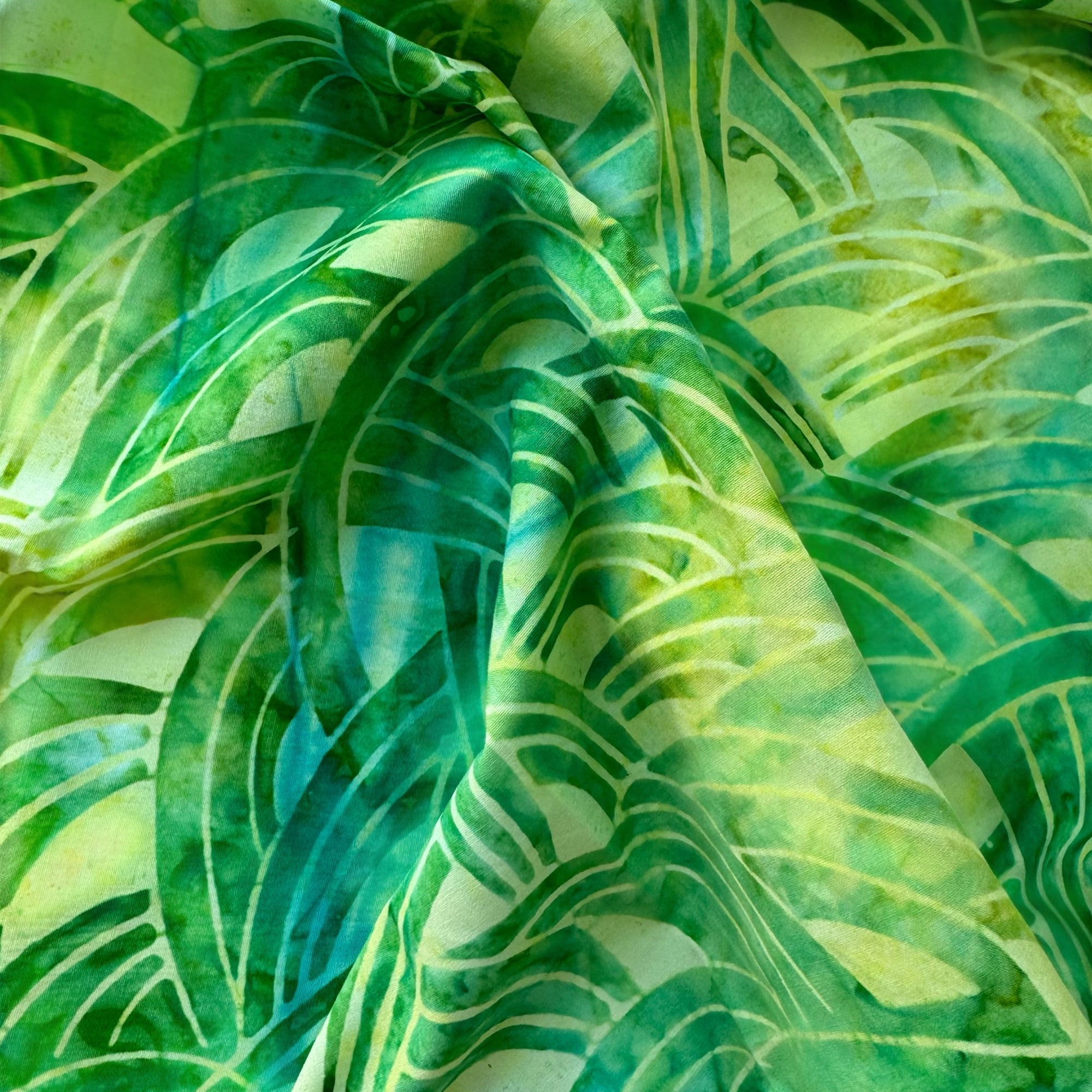 Tela batik verde hojas tropicales