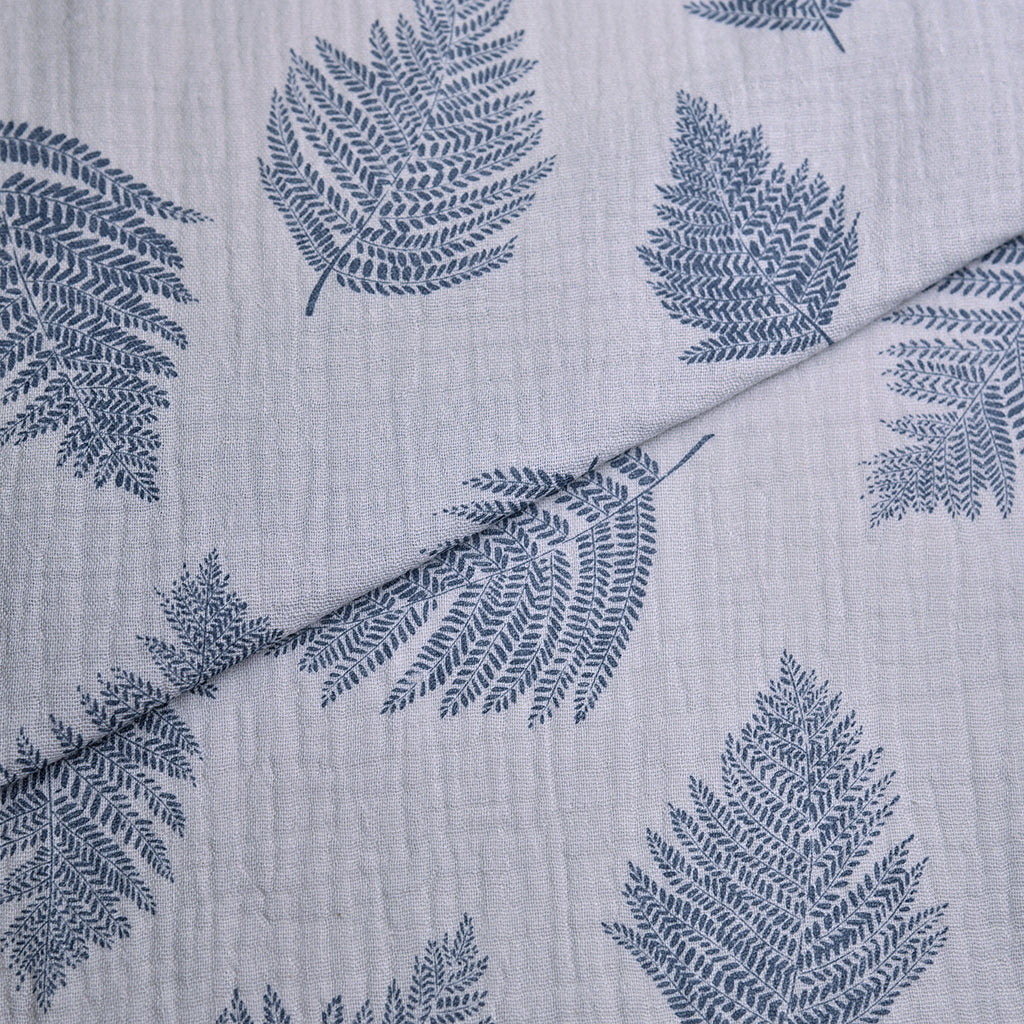 Tela doble gasa/muselina orgánica estampado hojas azul denim (cm) CERTIFICADO GOTS