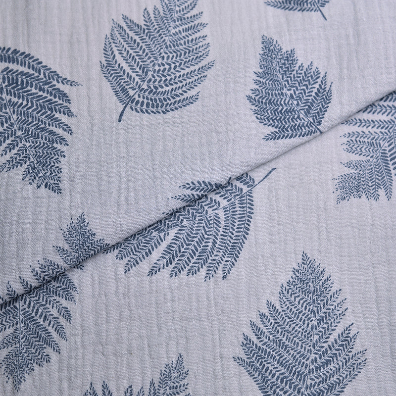Tela doble gasa/muselina orgánica estampado hojas azul denim (cm) CERTIFICADO GOTS