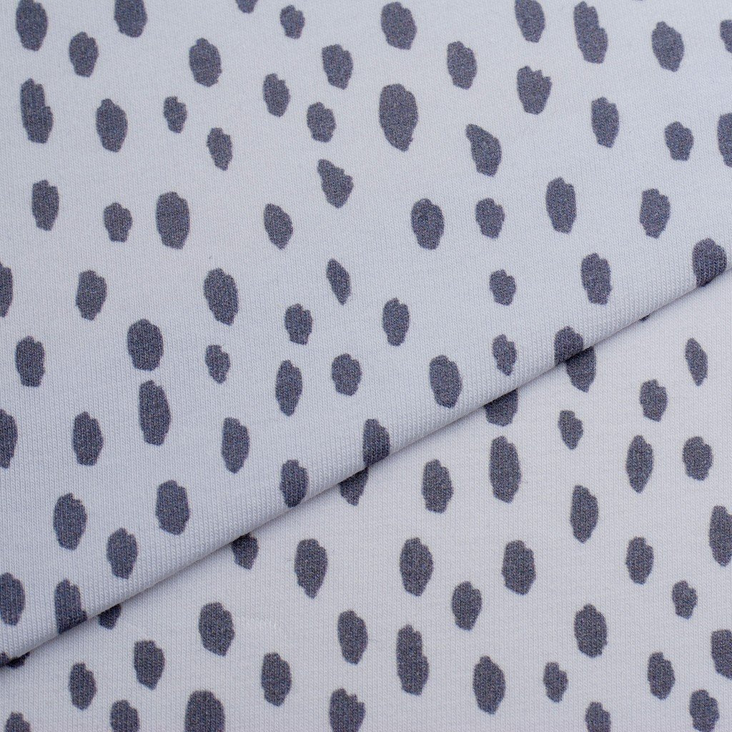 Tela punto estampado manchas