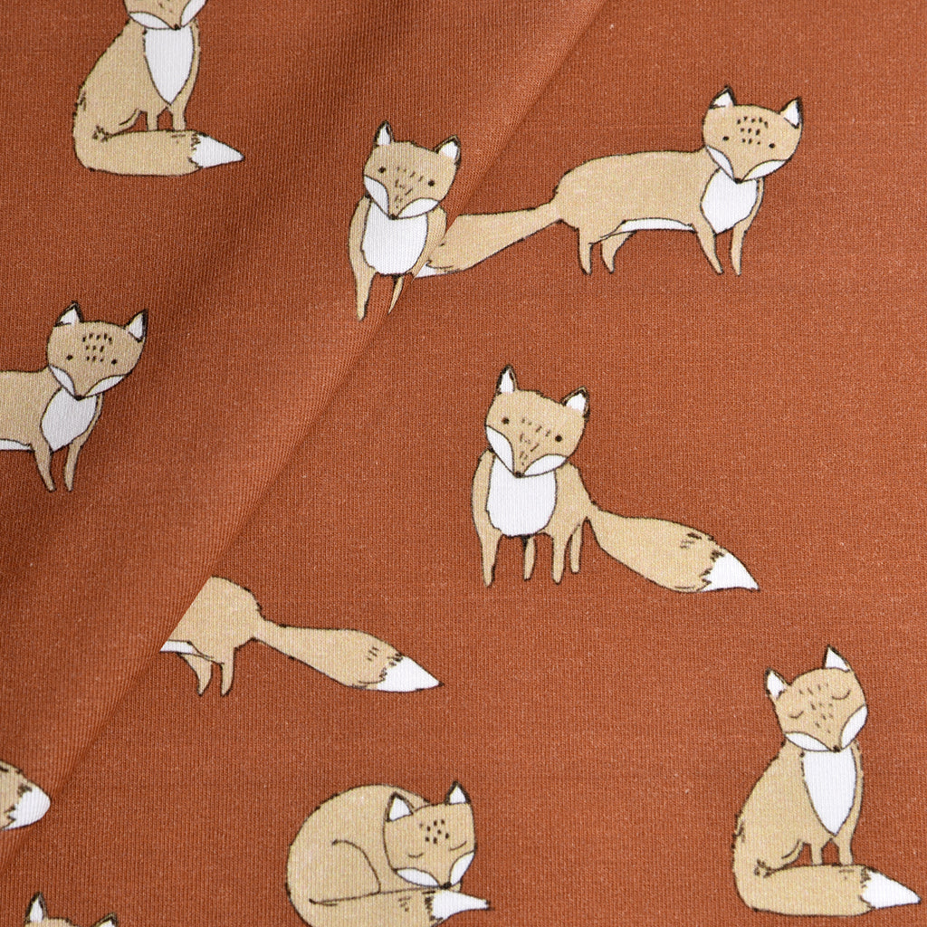Tela punto estampado zorros marrón/teja (CM)