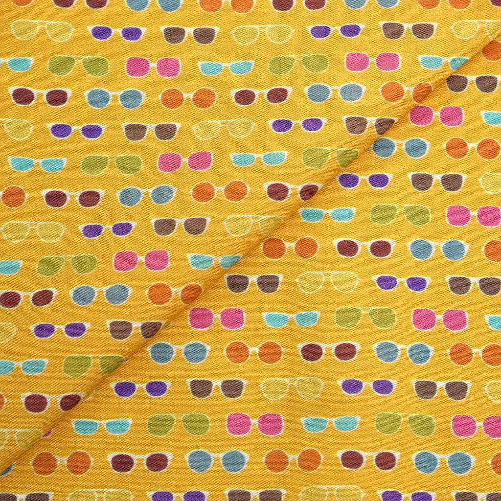 Tela 100% algodón estampado gafas amarillo/naranja (CM)